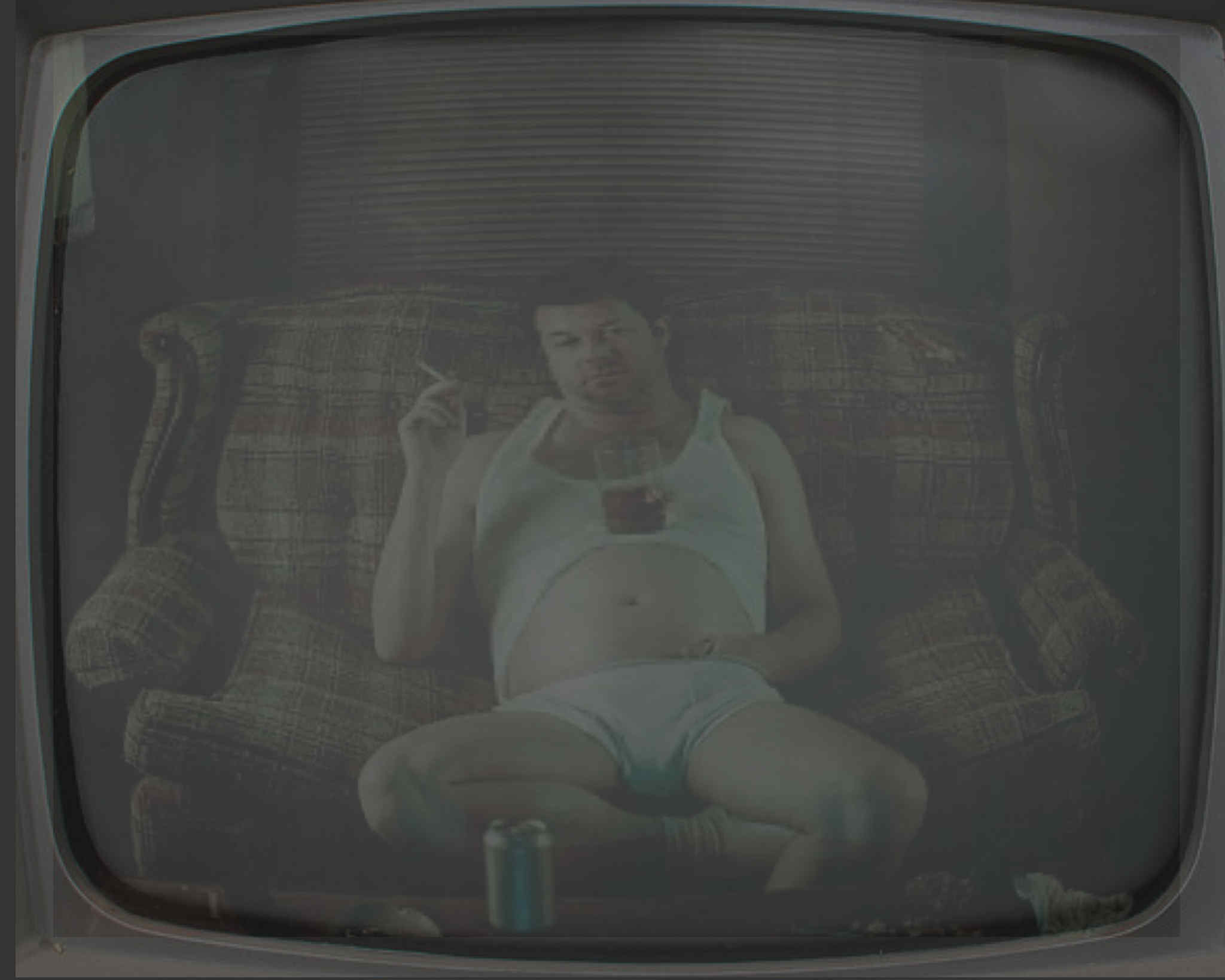 man in reflection of tv